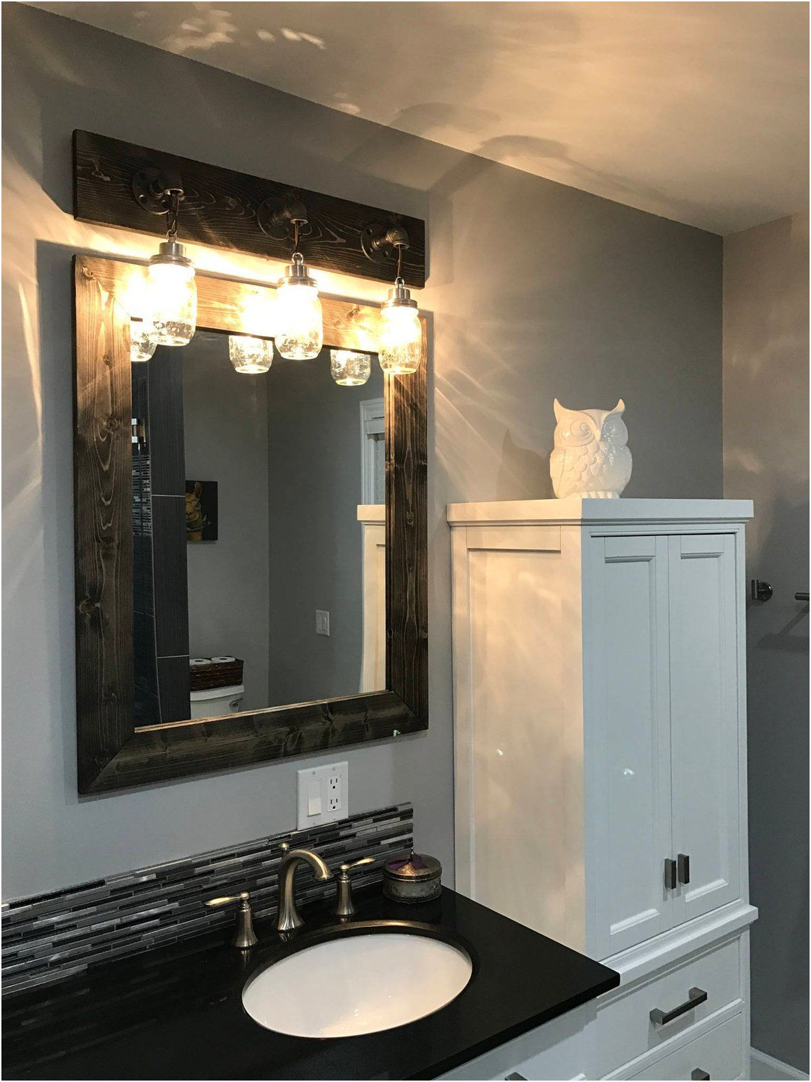 Elegant Framing Out A Mirror In Bathroom